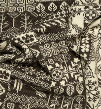 Load image into Gallery viewer, Close-up of a black and white patterned wool scarf