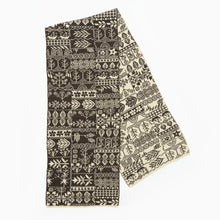 Load image into Gallery viewer, Patterned wool scarves, one black and white, the other beige and black, on a white background.
