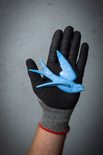Load image into Gallery viewer, Black glove with a blue lucky swallow bird decoration on a grey background