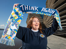 Load image into Gallery viewer, Designer holding colourful Scotland supporter scarf with modern design