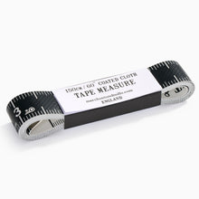 Load image into Gallery viewer, Merchant and Mills bespoke tape measure laid flat showing black and white tailor markings