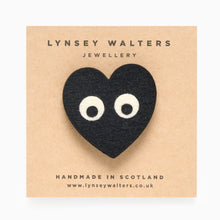 Load image into Gallery viewer, Black heart felt brooch with eyes handmade by Scottish jewellery designer Lynsey Walters