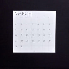 Load image into Gallery viewer, March calendar on a black background