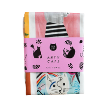 Load image into Gallery viewer, Arty Cats tea towel shown packaged up in modern gift packaging with colourful designs and 'Arty Cats' branding on a pink label with black text and black cats