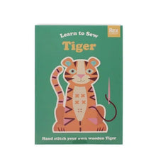 Load image into Gallery viewer, Book cover of 'Learn to Sew Tiger' by Rex London with a tiger illustration on a green background.