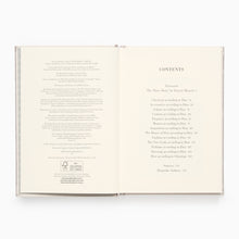 Load image into Gallery viewer, Open pages of Christian Dior quote book showing elegant typography layout