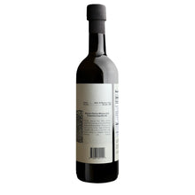 Load image into Gallery viewer, label with olive oil product details shown close up. Dark bottle with white label and white background.