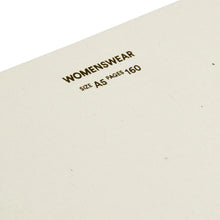 Load image into Gallery viewer, Close-up detail of Fashionary sketchbook cover with embossed typography