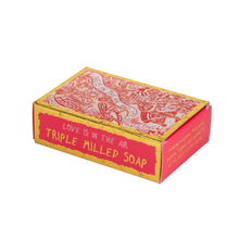 Load image into Gallery viewer, gold and red illustrative packaging by Arthouse Unlimited. Packaging showing the words 'triple milled soap', and 'love is in the air and it's disgusting'.