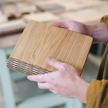 Load image into Gallery viewer, Handcrafted oak refillable notebook made in Dundee by The Bonny Company showing natural wood grain and laser-cut hinge detail.