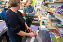 Load image into Gallery viewer, Behind-the-scenes view of recycled exhibition banner tote bags being handcrafted in Scotland in the Britton Scotland studio.