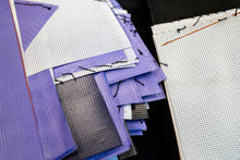 Load image into Gallery viewer, Close-up of portrait tote bag showing zip closure, interior lining and recycled PVC exhibition banner material.