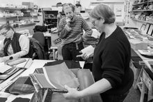 Load image into Gallery viewer, Behind-the-scenes view of recycled exhibition banner tote bags being handcrafted in Scotland at Britton Scotland studio.