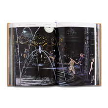 Load image into Gallery viewer, Open Louis Vuitton Catwalk fashion book showing Louis Vuitton collection imagery and designer fashion details