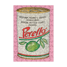 Load image into Gallery viewer, Jigsaw puzzle with a Perello olives can design on a pink border