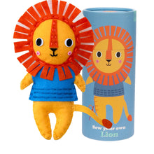Load image into Gallery viewer, Felt lion with blue body and orange mane next to a blue tube with lion illustration