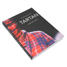 Load image into Gallery viewer, Book titled 'Tartan' by Jonathan Fayers with a red and blue plaid pattern on a white background