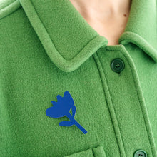 Load image into Gallery viewer, Tom Pigeon Flax Bloom cobalt blue brooch worn on a green jacket