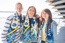 Load image into Gallery viewer, Group wearing Scotland Football scarves designed by V&A Dundee