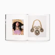 Load image into Gallery viewer, Vivienne Westwood and Jewellery book interior spread with close up of jewellery and a male model wearing decorative earrings