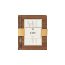 Load image into Gallery viewer, Handcrafted walnut wooden refillable notebook with branded band packaging by The Bonny Company.