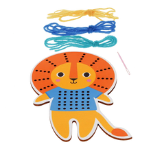 Load image into Gallery viewer, Wooden lion stitch board with four colourful lengths of yarn