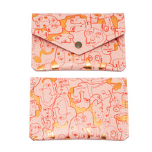 Load image into Gallery viewer, Three leather popper purses with foil embossed designs, in beige, pink, and black color, displayed against a white background.