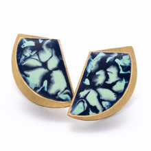 Load image into Gallery viewer, A pair of fanfold earrings with a brushed brass texture and cold enamel in teal and blue shades, with sterling silver posts.