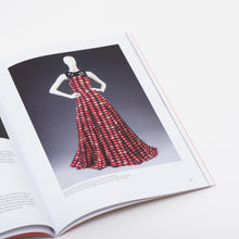 Load image into Gallery viewer, inside page showing museum display of a model wearing a dress at V&A dundee