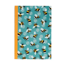 Load image into Gallery viewer, A5 notebook with a colourful repeating bumblebee pattern on a turquoise cover.
