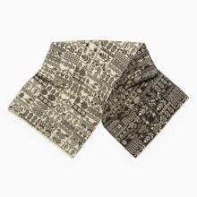 Load image into Gallery viewer, Folded wool scarf with intricate black patterns on a white background
