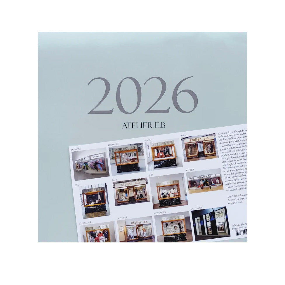 Calendar with '2026' and 'Atelier E.B.' text on a light blue background