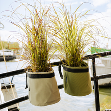Load image into Gallery viewer, Fabric plant pots by BACSAC used for urban balcony gardening with plants shown on balcony railings
