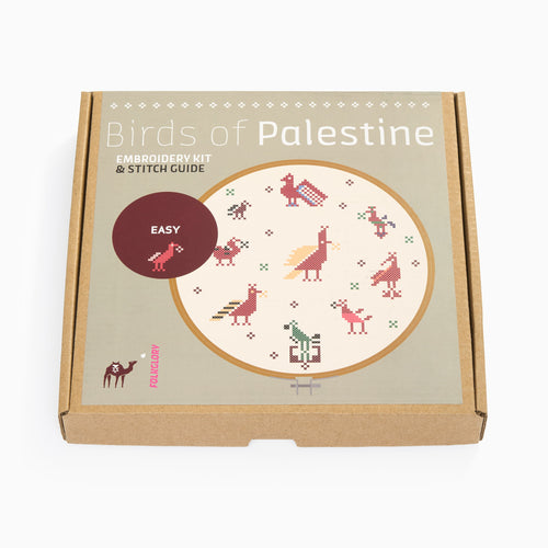 Embroidery kit packaging with 'Birds of Palestine' design on a beige background