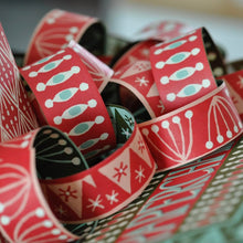 Load image into Gallery viewer, Close up shot of Cambridge Imprint red patterned paperchain
