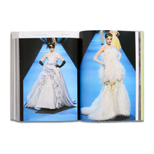 Load image into Gallery viewer, Open Dior Catwalk fashion book showing couture dresses on a blue catwalk, a stylish coffee table book gift for Dior fans
