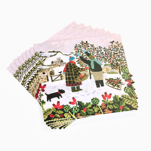 Set of Christmas-themed napkins with winter scene design on a white background