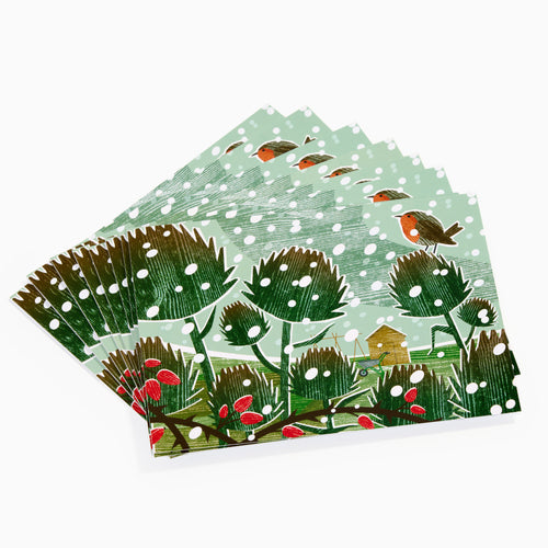 Charity Christmas Cards 2025 red robin iluustrative outdoor scene with green trees and red berries