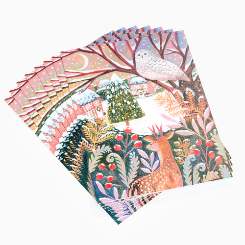 Set of colourful nature-themed napkins with deer, birds, and trees on a white background