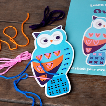 Load image into Gallery viewer, Wooden owl sewing activity with colourful yarn threaded through the stitch board

