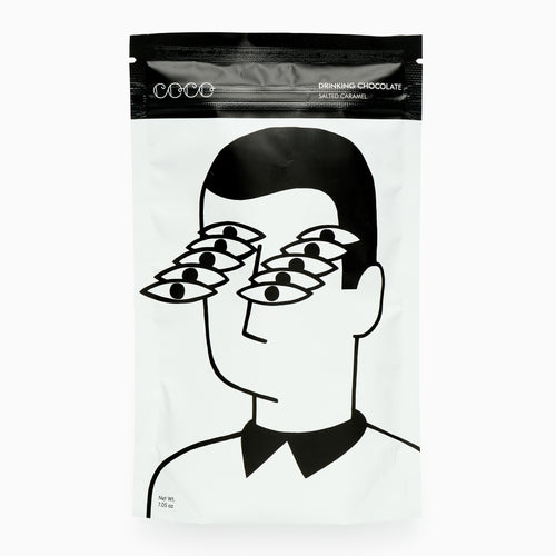 Packaging of drinking chocolate with a stylized illustration of a person wearing multiple pairs of glasses.
