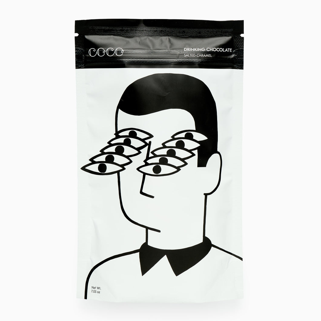 Packaging of drinking chocolate with a stylized illustration of a person wearing multiple pairs of glasses.
