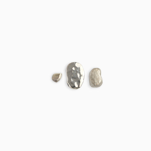 A set of three sterling silver stud earrings with varying finishes, displayed against a white background.