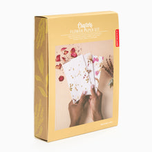 Load image into Gallery viewer, A boxed Paper Making Kit by Crafters, featuring a person holding floral paper within a wooden frame, with flowers and a sponge also visible in the box.
