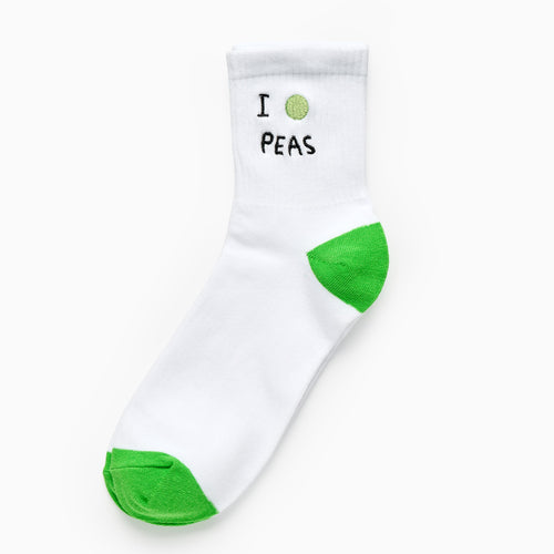 White sock with green accents and text 'I “pes”' on a white background
