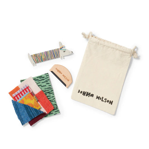 Set of colorful fabric swatches with a drawstring bag labeled 'Donna Wilson' on a white background