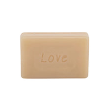 Load image into Gallery viewer, close up shot of the triple milled Arthouses Limited soap on a white background. The soap has the word "Love" indented into it. 
