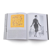 Load image into Gallery viewer, Open book Catwalk The Art of the Fashion Show A-Z showing a page with a black and white illustration of a woman in a dress and another with a yellow abstract design. by Vitra Design Museum &amp; V&amp;A Dundee
