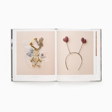 Load image into Gallery viewer, Vivienne Westwood ppen book displaying decorative jewellery and headband with teddy bear and heart designs on a white background
