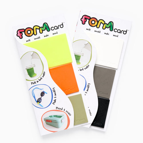 Two FORM card packages with colorful labels on a white background